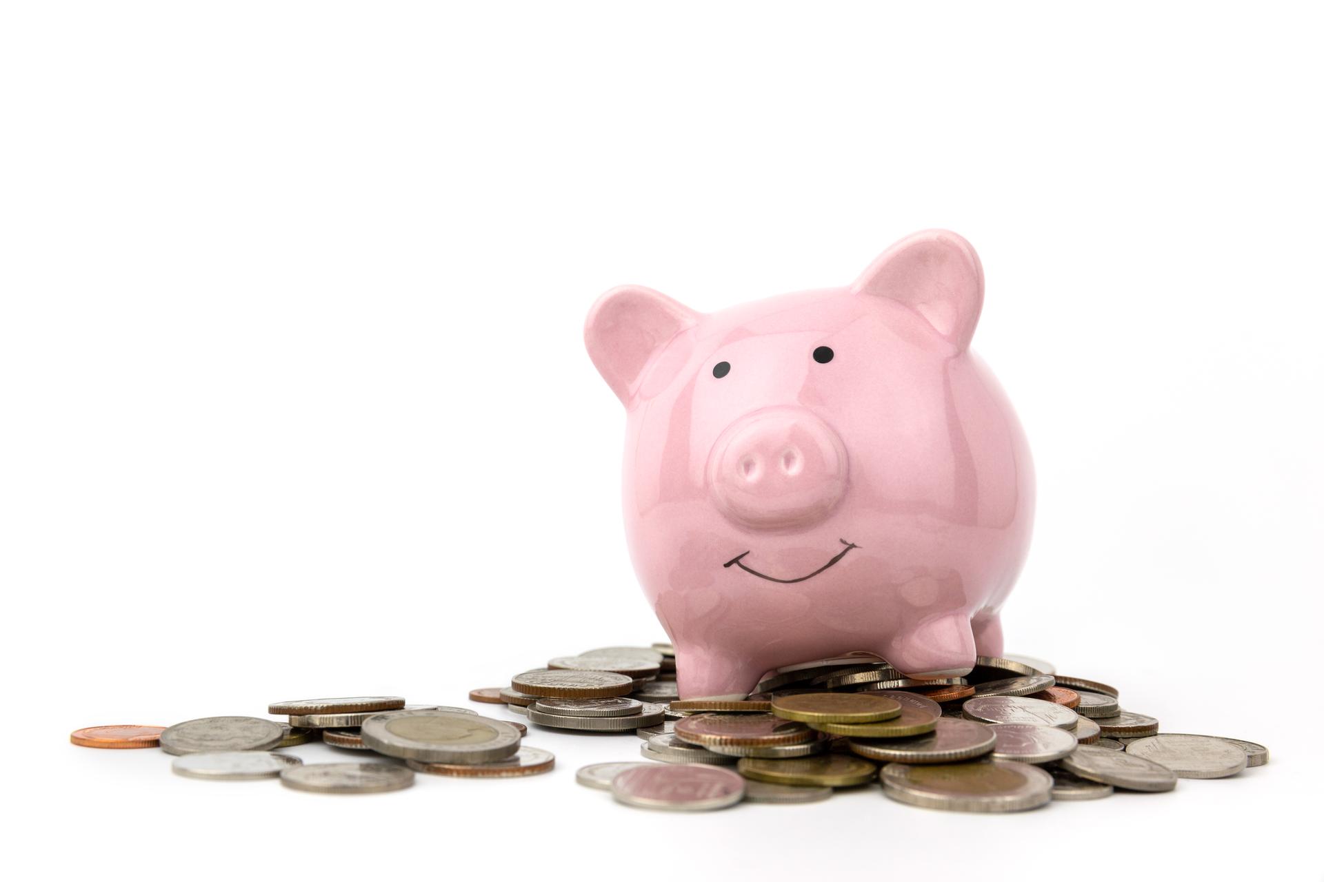 Piggy bank on stack of Coins on white background .Saving money for business and financial concept.Save for retirement planning.