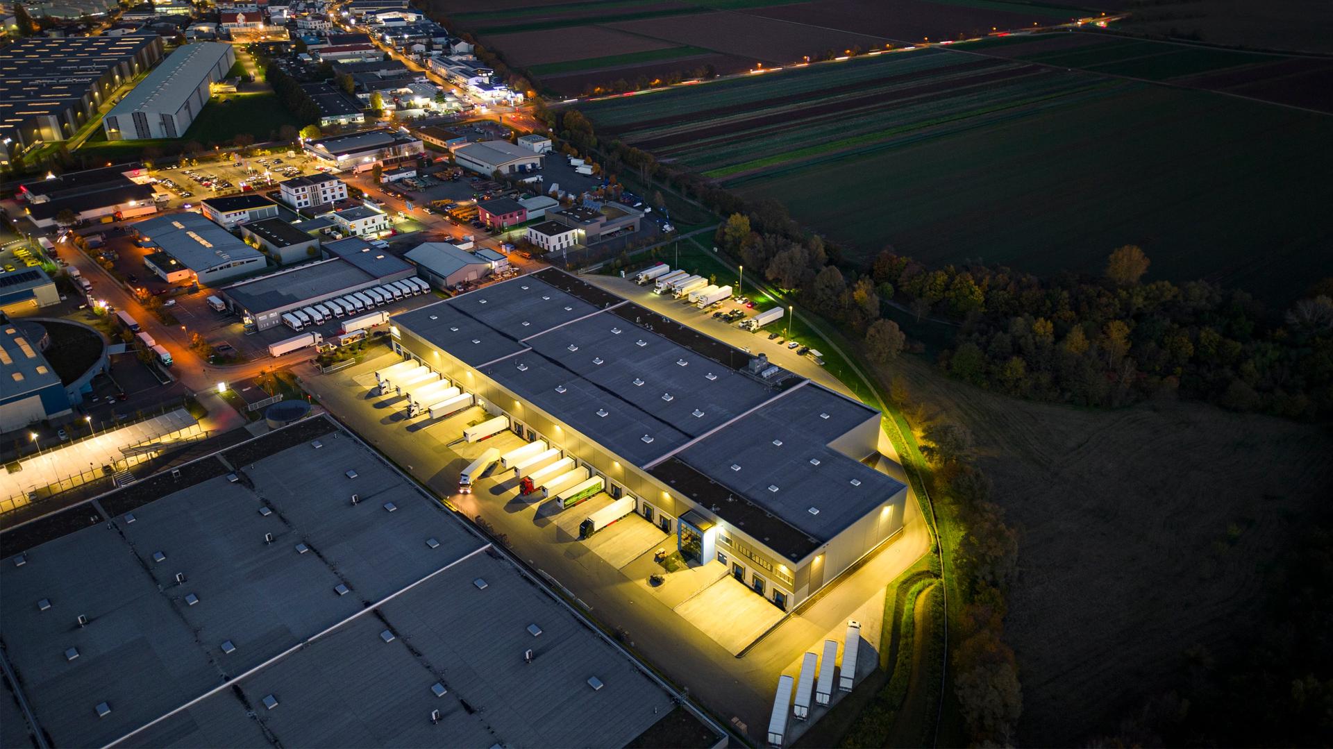 Distribution warehouse at dusk - aerial view