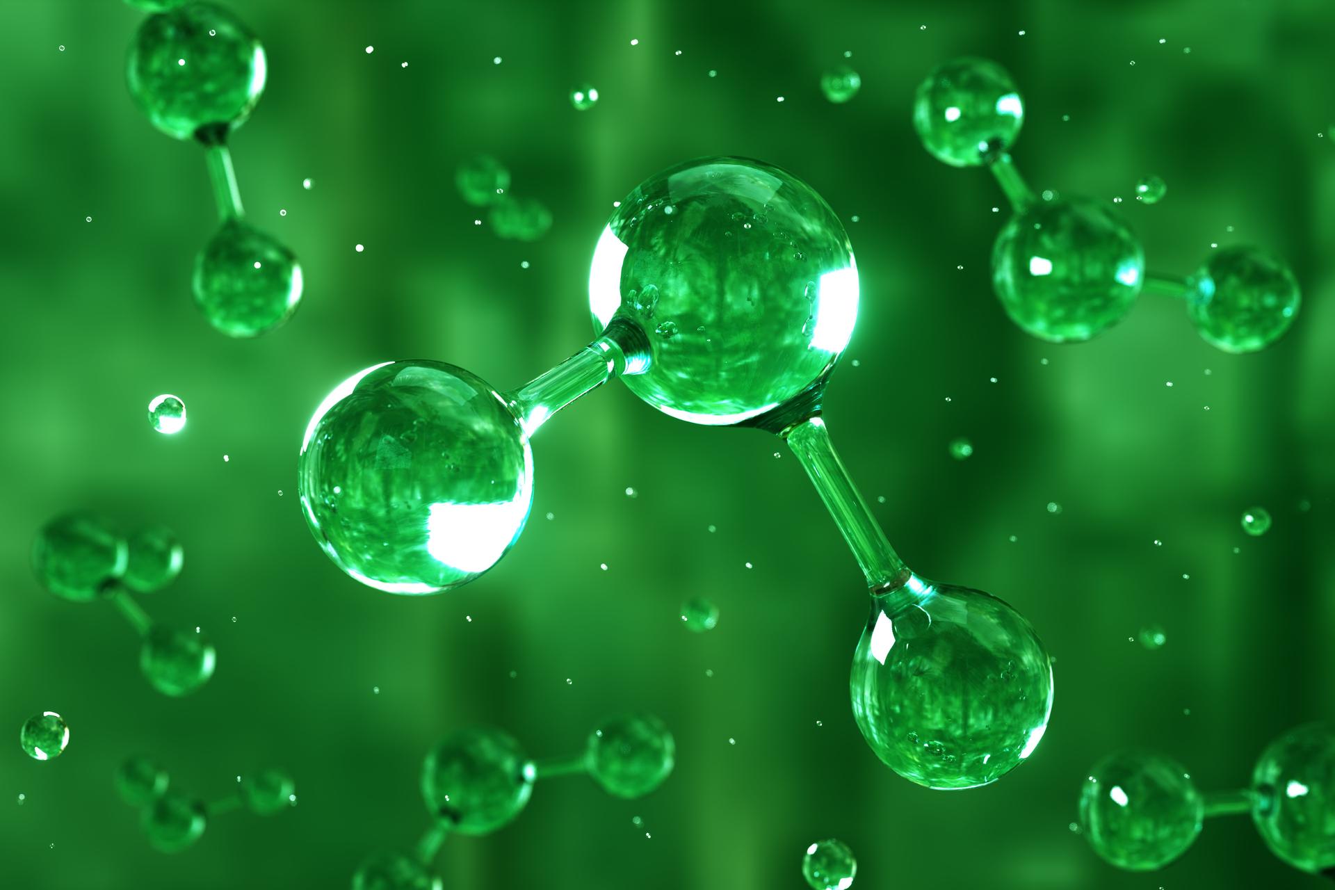 Digital generated image of H2 hydrogen molecule made out of liquid on green background.