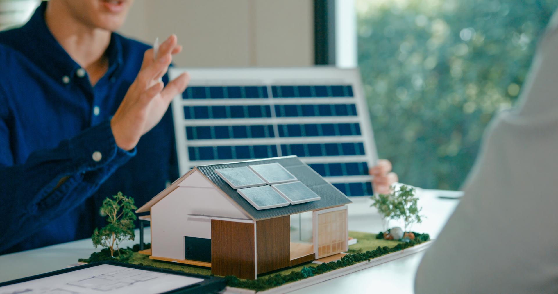 Closeup of young Asian couple in detailed consultation with real estate agent, who is highlighting advantages of home with solar panels. Consulting on Eco-Friendly Home with Real Estate Agent Concept.
Ifea